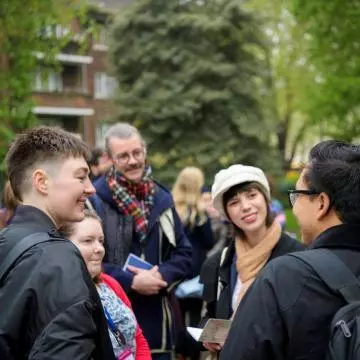 people talking outside in the community 