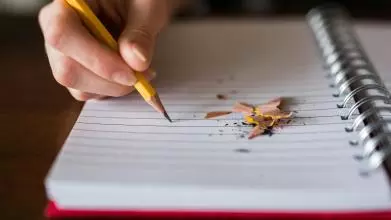 Pencil writing in a notepad