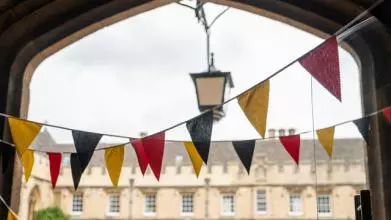 Colourful bunting in a college archway