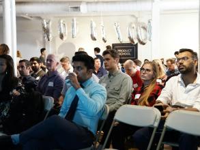 People sat down at a conference