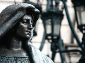 statue of a woman in a hood
