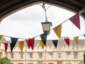 Colourful bunting in a college archway